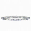 Kouchta Tennis Classique : ligne de moissanites rondes quatre griffes, argent 925 or blanc 18K
